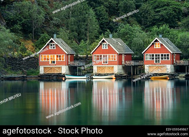 Flam, Norway. Famous Red Wooden Docks In Summer Evening. Small Tourist Town Of Flam On Western Side Of Norway Deep In Fjords