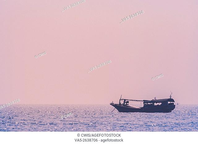 Hainan Island, China - The view of a fishing ship anchoring off the shore