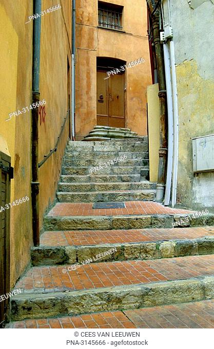 Stairs between buildings, in Grasse, France