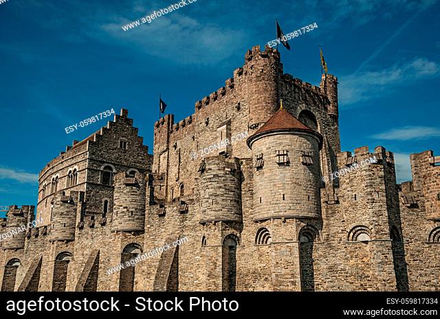 Close-up of stone wall and watchtower of the Gravensteen Castle in Ghent. In addition to intense cultural life, the city is full of Gothic and Flemish style...