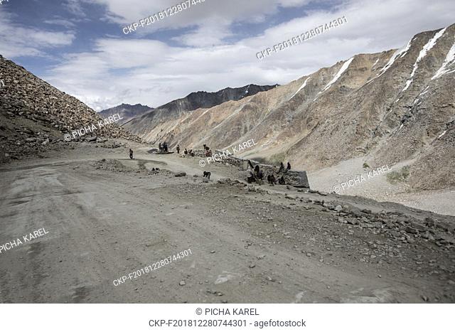 Mountain road between Leh and Nubra valley. At the nearby highest pass in the world Khardung La, Ladakh, Jammu and Kashmir, India, July 18, 2018