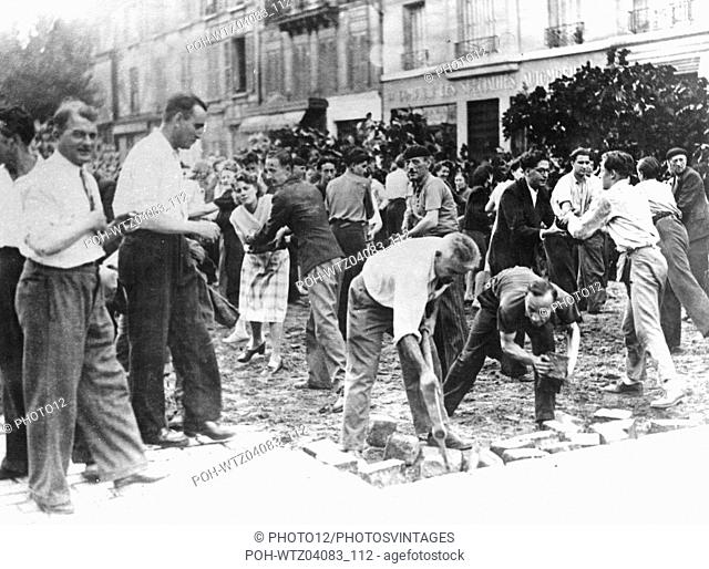 Civilians pulling out cobblestones in the streets, during the Paris uprising World War II Liberation of Paris