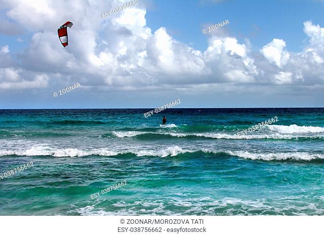 Kiteboarder enjoy surfing in water