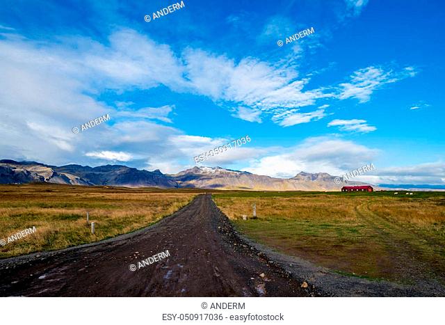 Endless Dirt road and blue sky in Iceland
