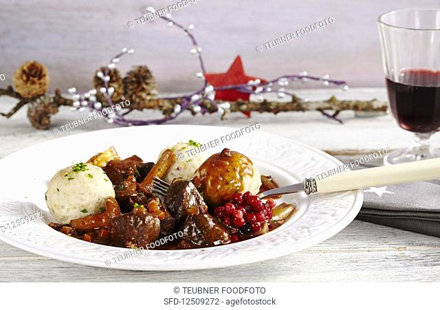 Venison goulash with bacon, chanterelle mushrooms, mini bacon dumplings and lingon berries
