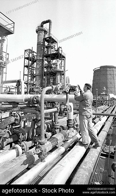 An employee of the ""Chemical Plant of the Czechoslovak-Soviet Friendship"" works with a distillation equipment through flows first petroleum of the Druzhba...