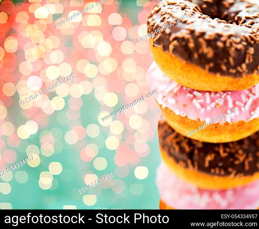 close up of glazed donuts with sprinkles