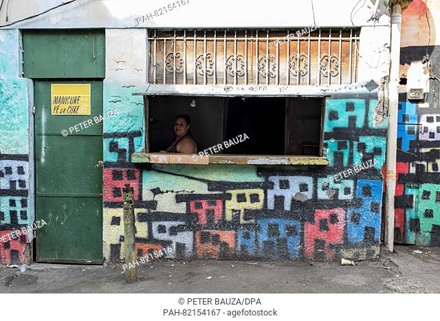 A small kiosk on Rua 2 (one of the most conflict-troubled streets due to continous crossfire) with wall paints by peacs activist Marieluce in the favela...