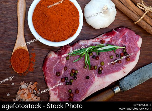 raw uncooked ribeye beef steak butcher selection