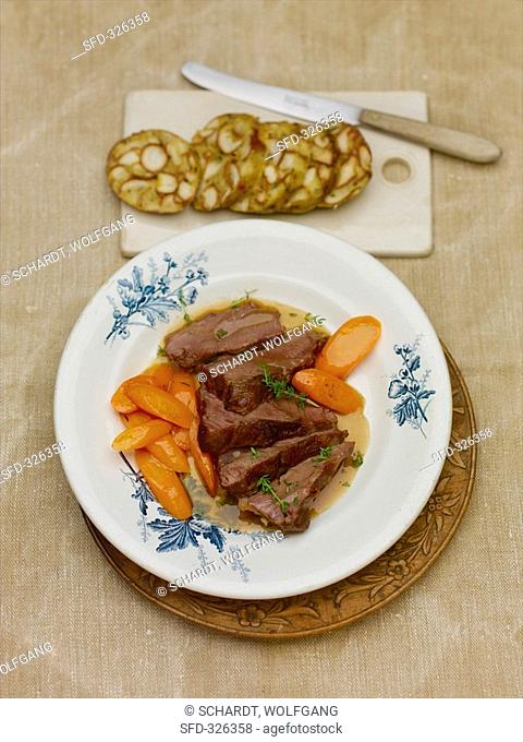 Braised veal cheeks with carrots and pretzel dumpling