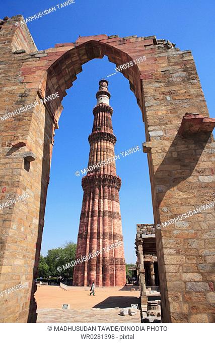 Qutab Minar through arch built in 1311 red sandstone tower , Delhi, India UNESCO World Heritage Site