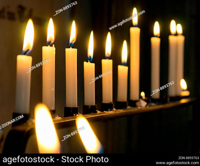 Candles in church. Selective focus on the candles at intersection