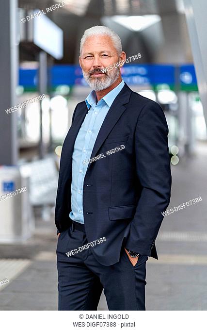 Mature businessman at the station platform