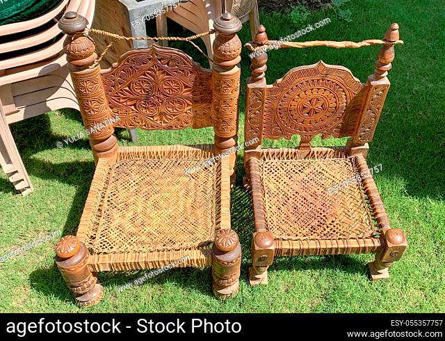 old handmade traditional wooden chairs from nothern Pakistan. Wood and leather craft