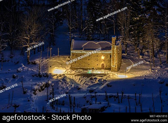 Sant Esteve Church, near Tredòs, in a winter blue hour (Aran Valley, Catalonia, Spain, Pyrenees)