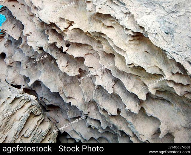 Surface sandy rock. Rocky shore of the Caspian Sea