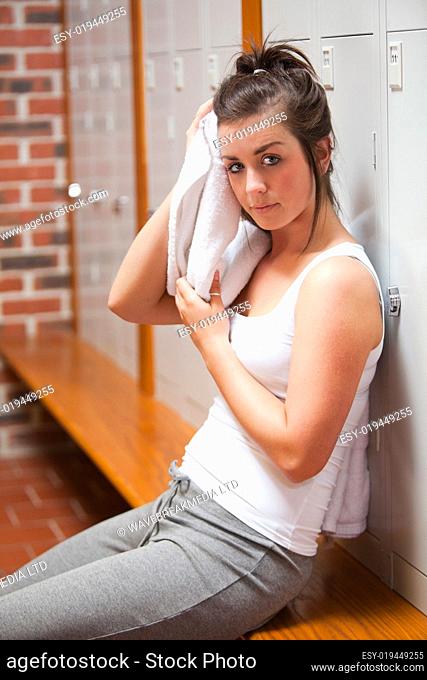 Portrait of a sports student drying her head