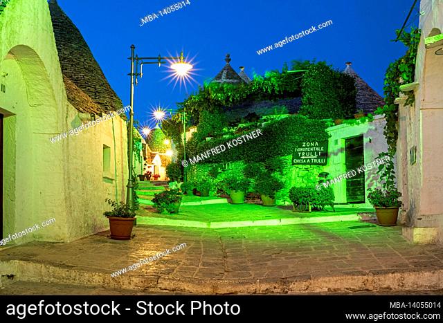 alberobello, bari province, salento, apulia, italy, europe. dawn in alberobelle with the typical trulli houses with their conical roof in drywall style