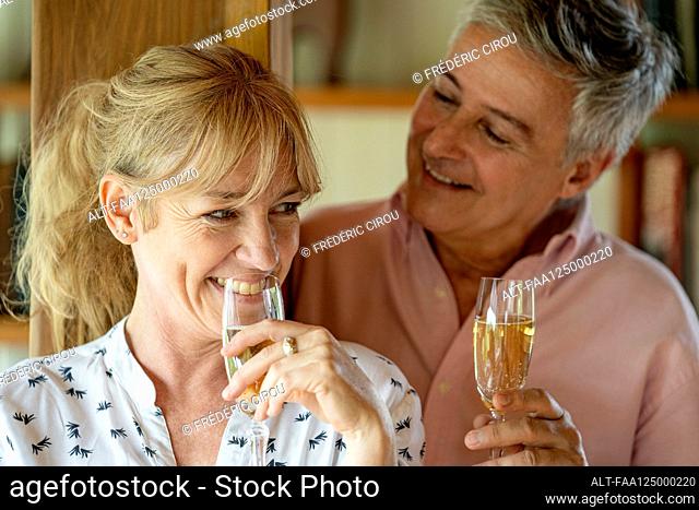 Senior couple drinking champagne
