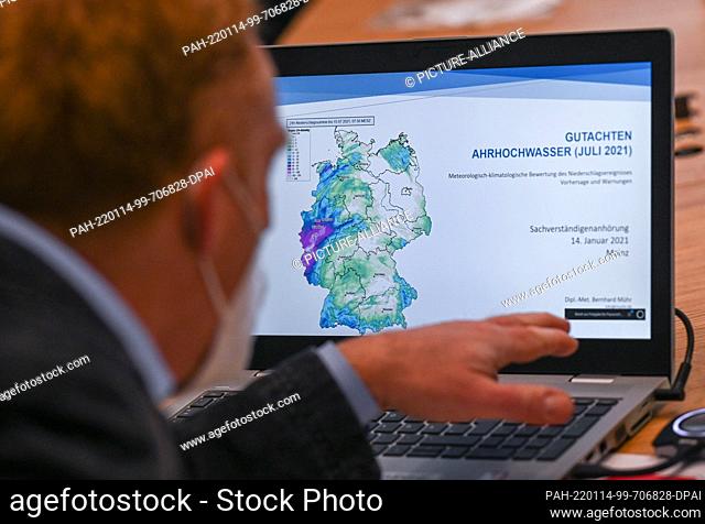 14 January 2022, Rhineland-Palatinate, Mainz: Bernhard Mühr, a meteorologist from Karlsruhe, sits in front of his laptop before his hearing at the meeting of...