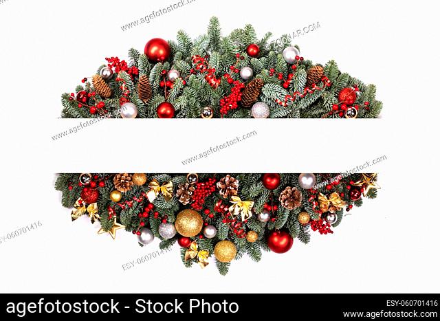Christmas white blank card with copy space and decor of fir tree branch bauble candy cane pine cone red holly berry isolated on white background