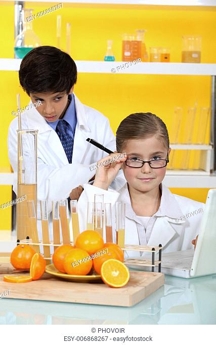 Two kids in science laboratory
