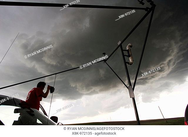 Storm chaser Bryan Draper with Project Vortex 2 watches a funnel cloud form in Goshen County, Wyoming, USA, June 5, 2009   Project Vortex 2 is a two year...