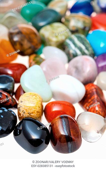many polished natural mineral gemstones close up