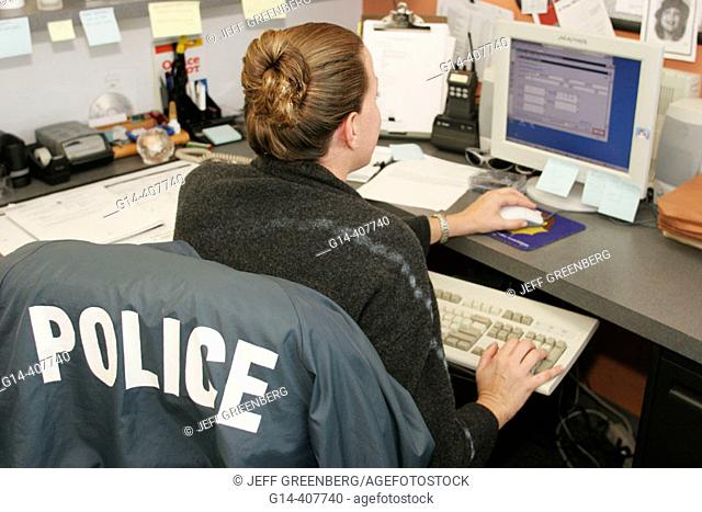 White female, computer monitor. North Miami Beach Police Department, Florida. USA