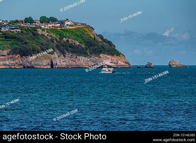 Paignton, Torbay, England, UK: June 06, 2019: View towards Torquay with a passenger ferry