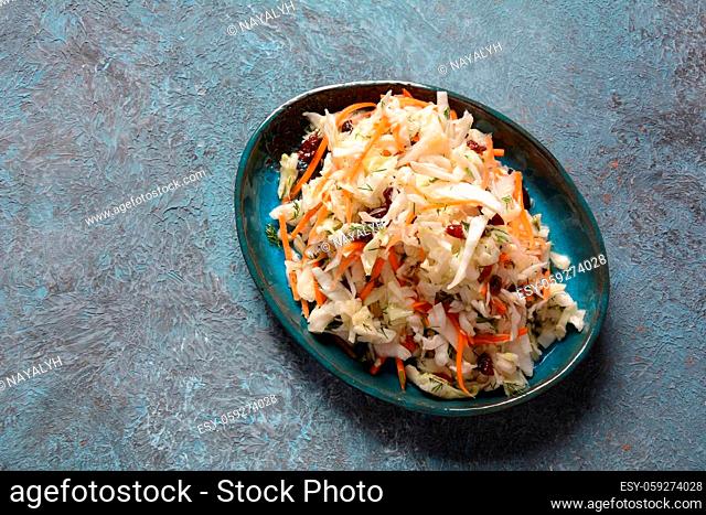 Cabbage salad with carrot, smoked almonds and dried cranberries. Coleslaw Salad