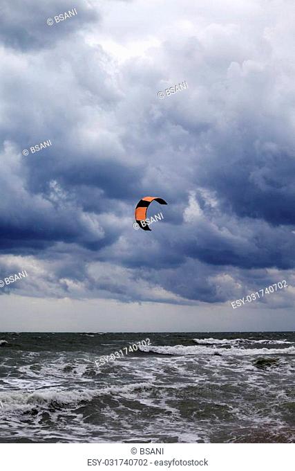 Power kite in Black Sea and gray sky