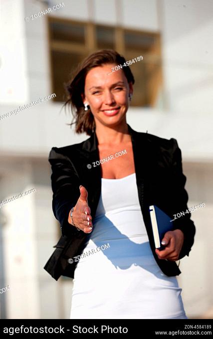 Portrait of beautiful businesswoman ready for handshake