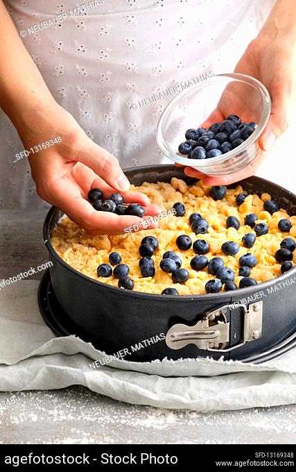 Blueberry crumble cake being made