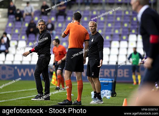 Union's head coach Felice Mazzu and Union's assistant coach Karel Geraerts talk to a referee during a soccer match between Beerschot VA and Union Saint-Gilloise