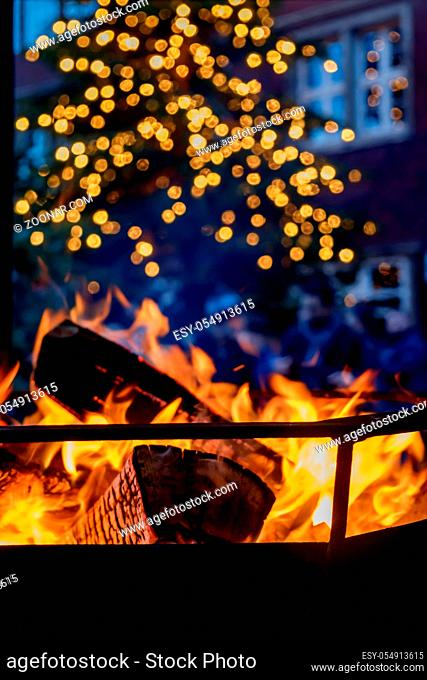 Close up shot of burning firewood in the fireplace at christmas time