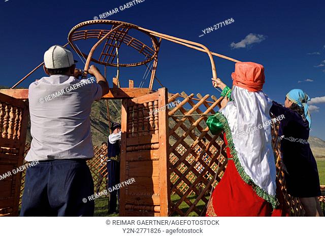 Saty villagers putting up a Yurt in Chilik river valley Kazakhstan