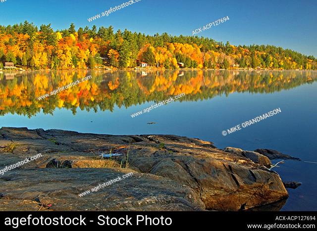 Cottages and Autumn colors along Carlyle Lake Killarney Provincial Park Ontario Canada