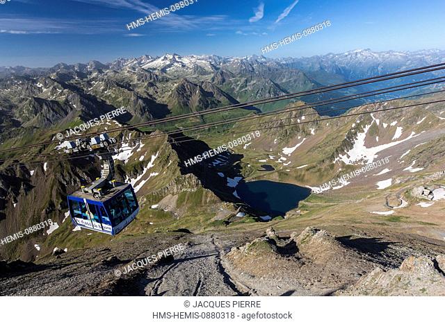 France, Hautes Pyrenees, Bagneres de Bigorre, La Mongie, lake of Oncet since the Pic du Midi de Bigorre (2877m) and the cabin of the cable railway of the Pic du...