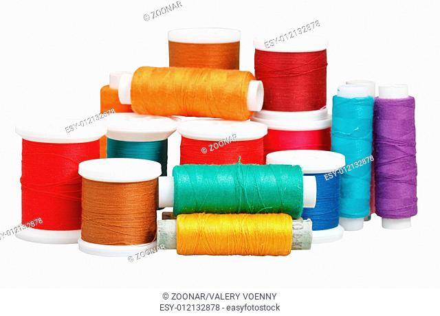 various thread spools isolated on white