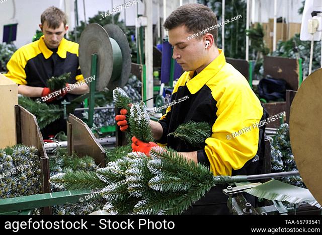 RUSSIA, NOVOROSSIYSK - DECEMBER 15, 2023: Workers assemble an artificial Christmas tree at the Novaya Yolka [New Fir Tree] factory