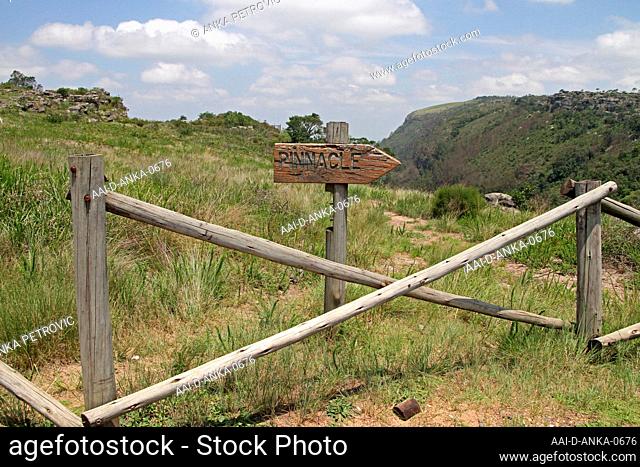 Entrance gate and sign pointing to The Pinnacle Rock in Driekop Gorge forest, Graskop, Drakensberg, Mpumalanga, South Africa