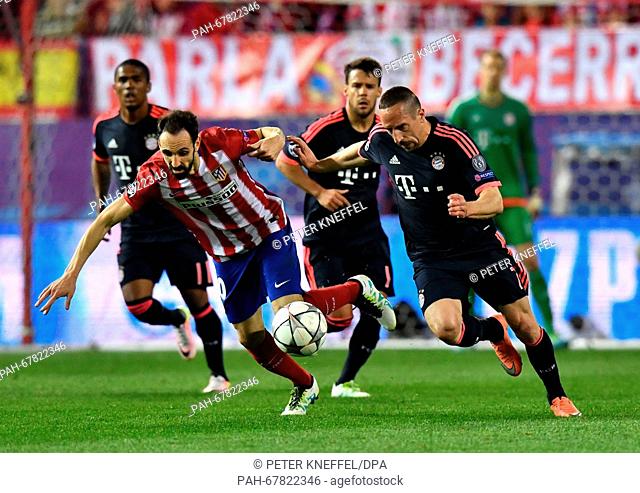 Munich's Franck Ribery (R) and Madrid's Juanfran Torres vie for the ball during the Champions League semi-final match between Atletico Madrid and Bayern Munich...