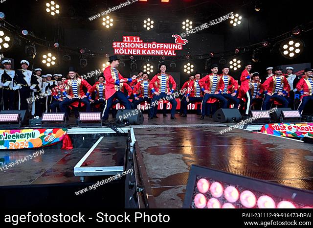 11 November 2023, North Rhine-Westphalia, Cologne: Carnivalists of the StattGarde Colonia Ahoy on stage on 11.11.2023 in Cologne at the opening of the 2023 2024...