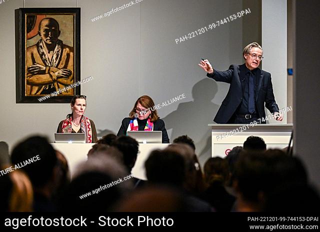 01 December 2022, Berlin: Markus Krause leads the auction of the painting ""Self-Portrait yellow-pink"" by Max Beckmann at the auction house Villa Grisebach