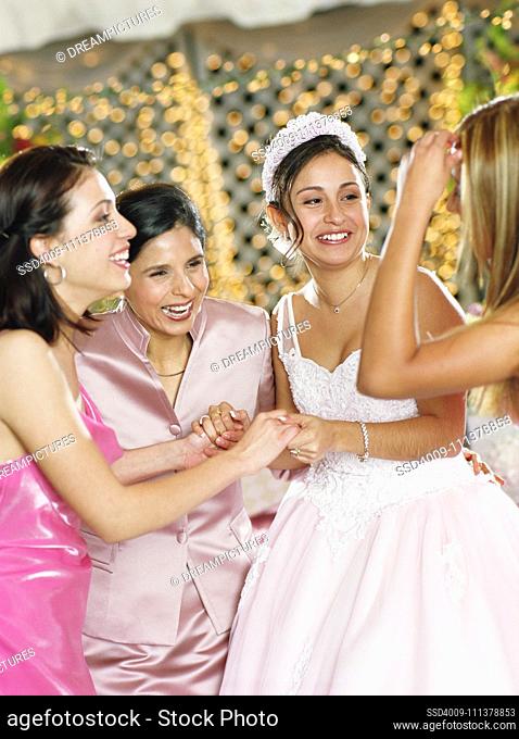 Bride celebrating with her bridesmaids