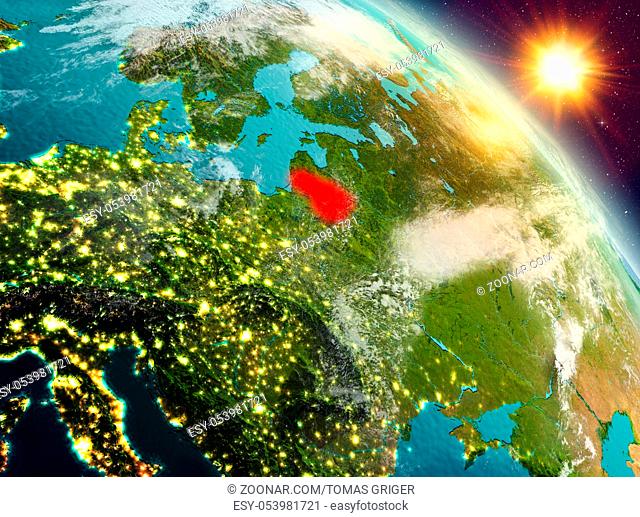 Sunrise above Lithuania highlighted in red on model of planet Earth in space. 3D illustration. Elements of this image furnished by NASA
