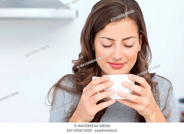 Woman waking with the smells of coffee