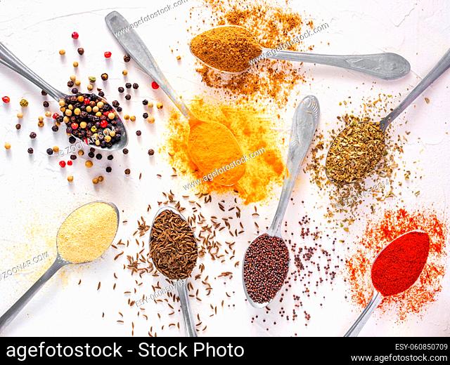 Top view mix indian spices and herbs difference on white background. Food background for design vegetable, healthy lifestyle, spices, herbs or foods content