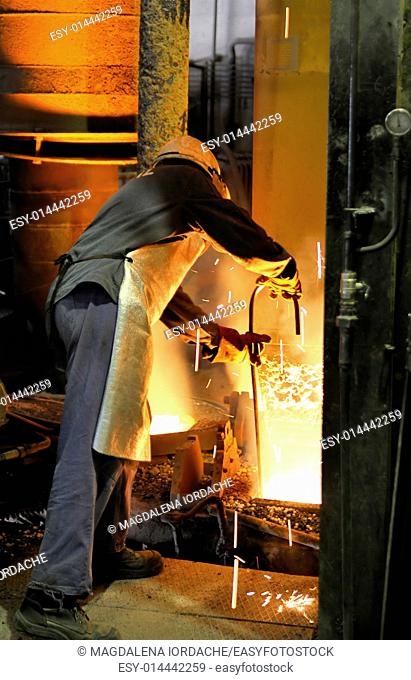 Molten hot steel and worker